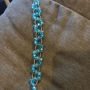 Elegant twisted silver tone Blue cluster facet Bracelet
